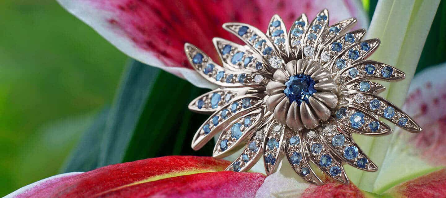 Flower shaped engagement ring with aquamarines