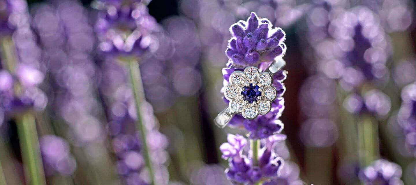 Cluster engagement ring on lavender background