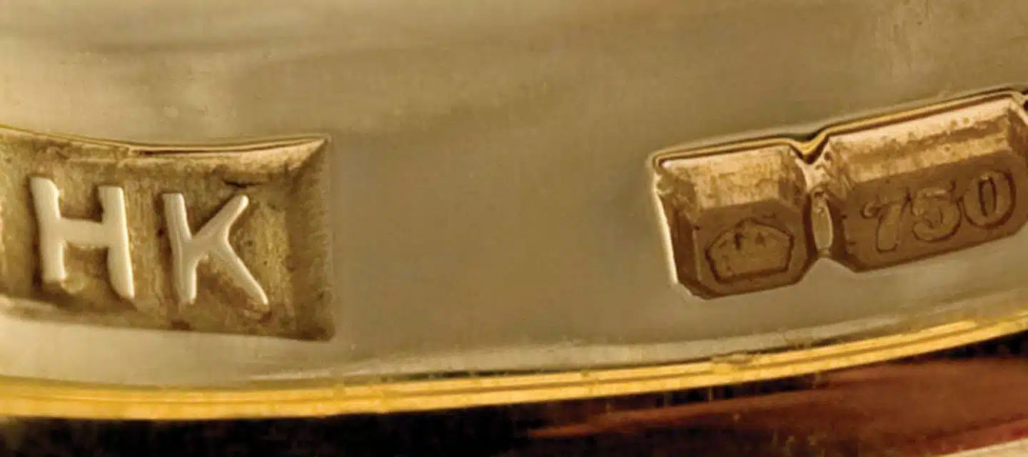 Closeup of hallmark stamp inside gold ring band