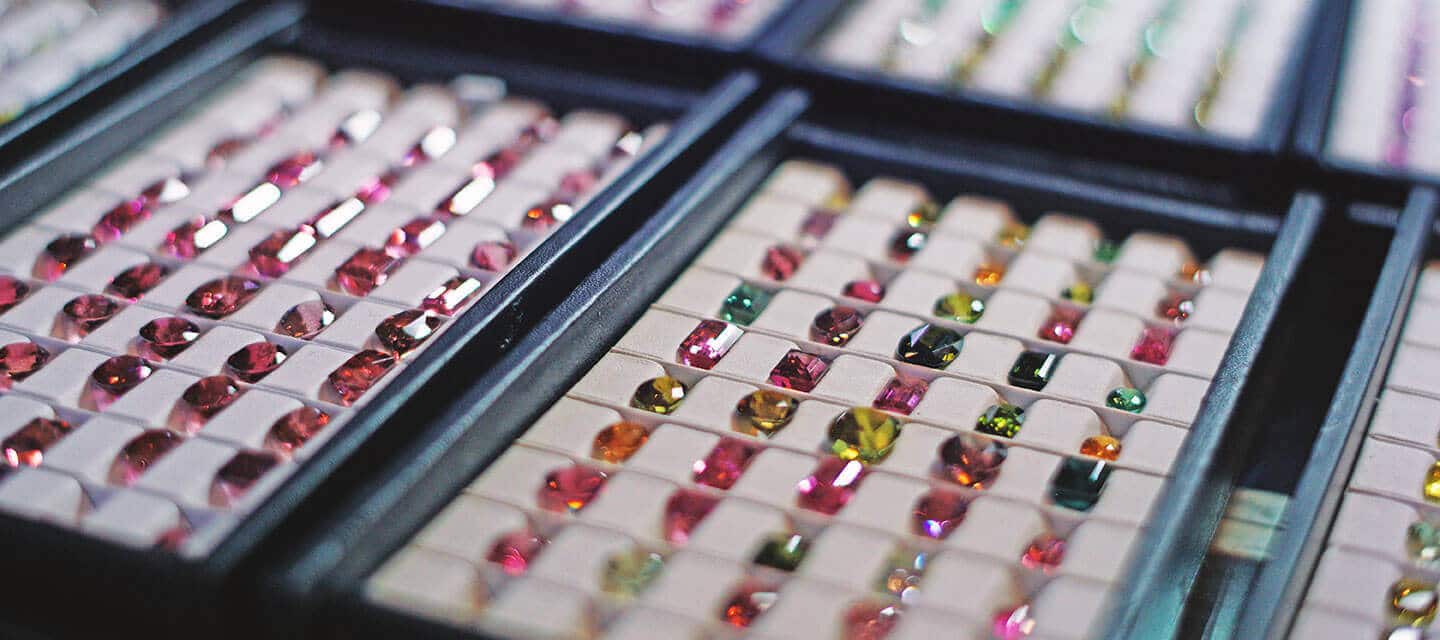 Multicoloured gemstones in display cases