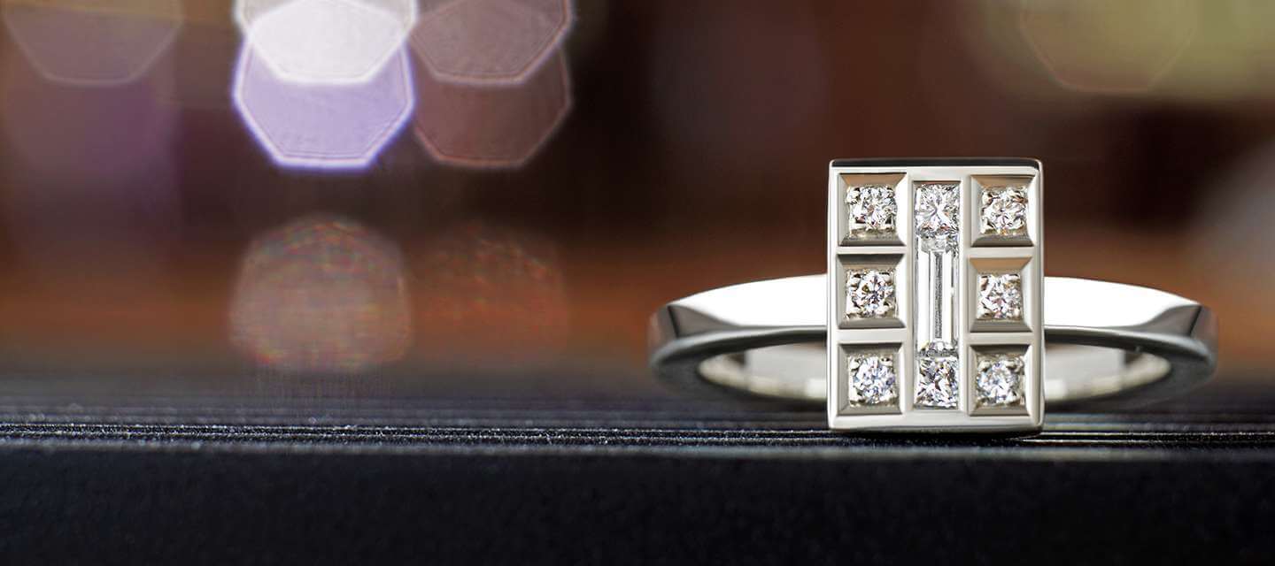 rectangular white gold ring on tabletop