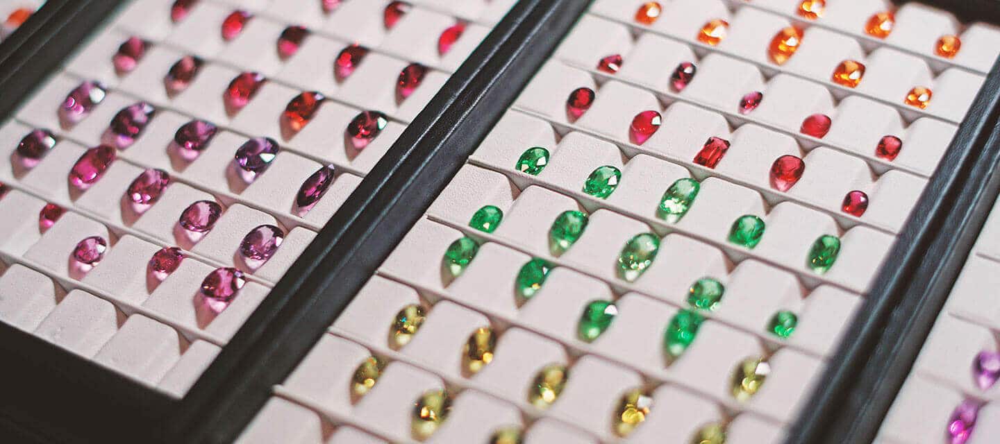 multicoloured birthstones in display cases