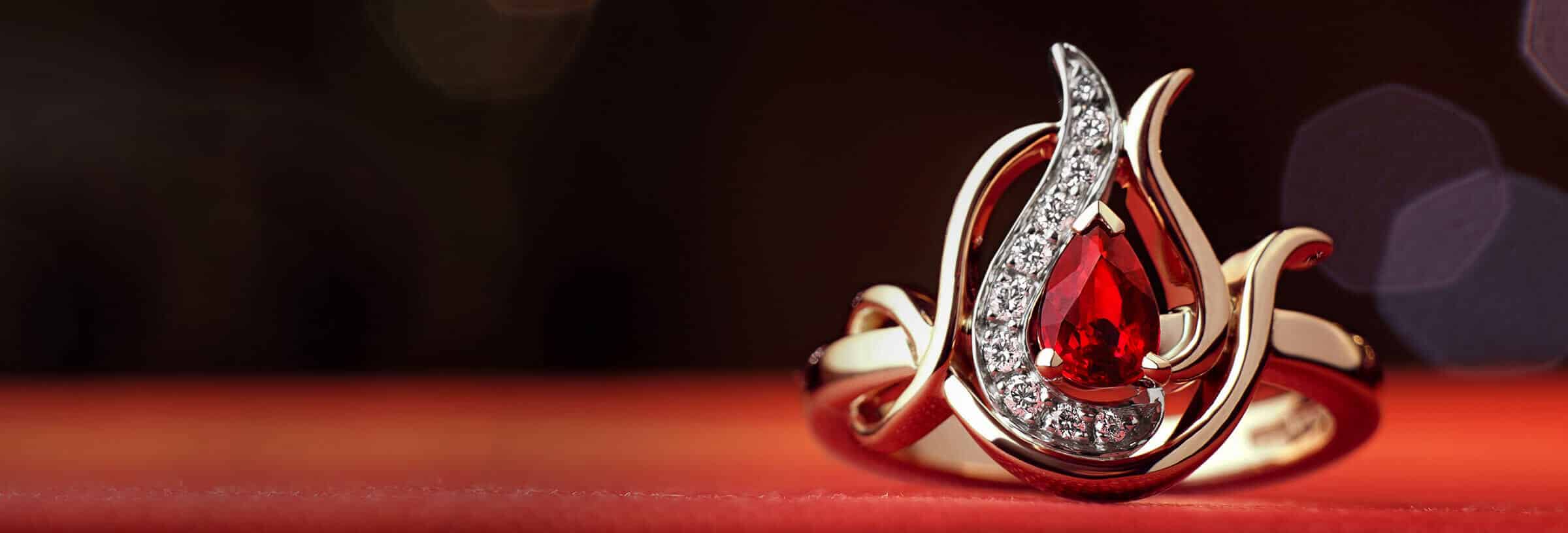 ruby engagement ring on red background