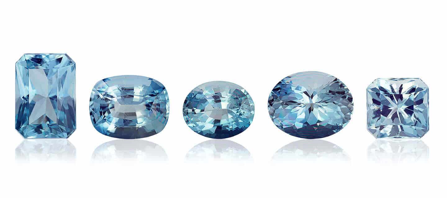 five aquamarine gemstone cuts on white background