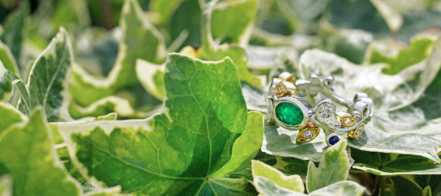 emerald ring on leaf background