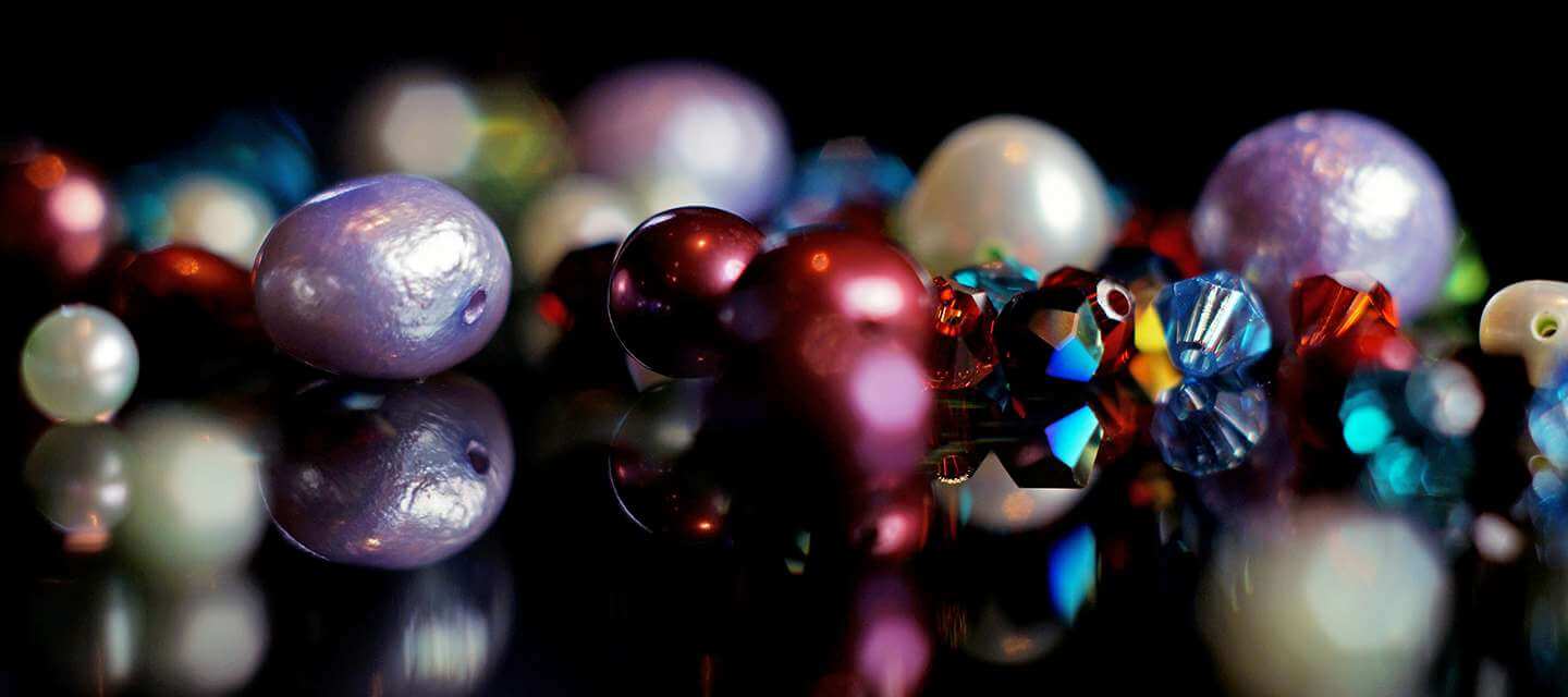 multicoloured river pearls on black background