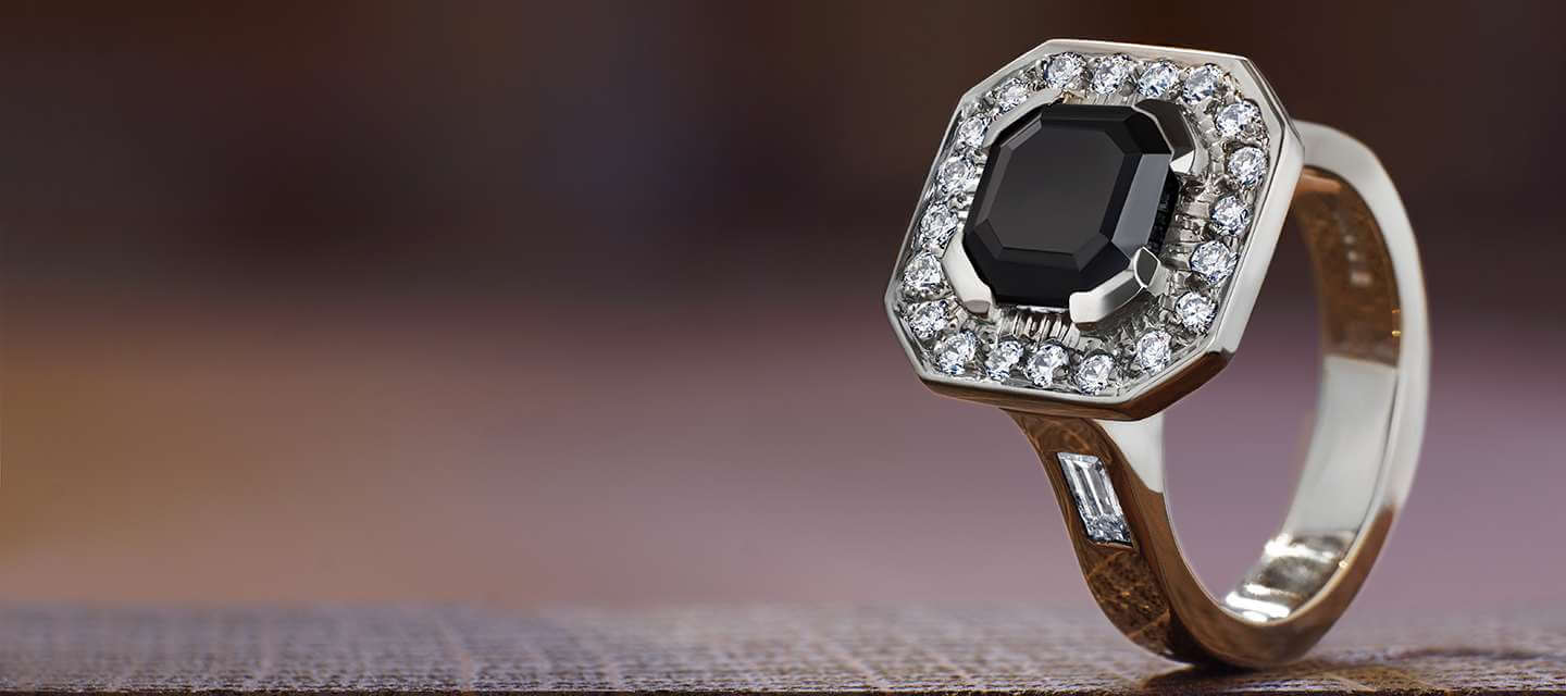 onyx engagement ring on textured background