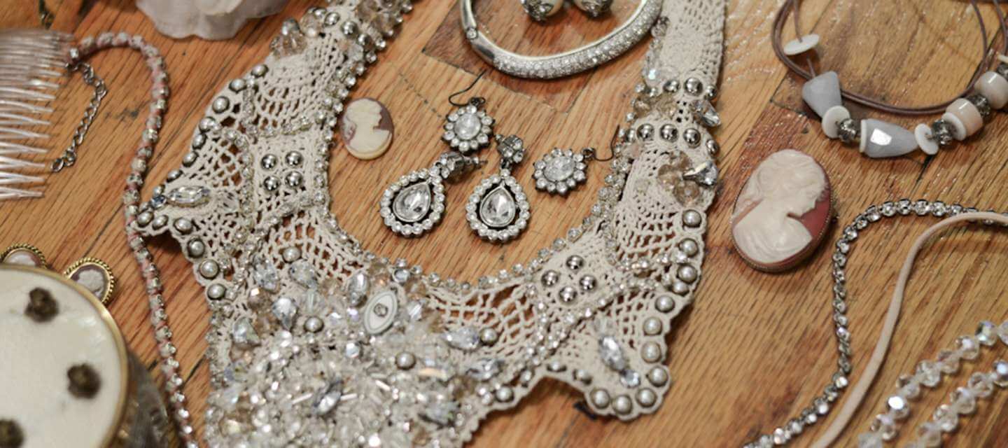 vintage jewellery against wood background