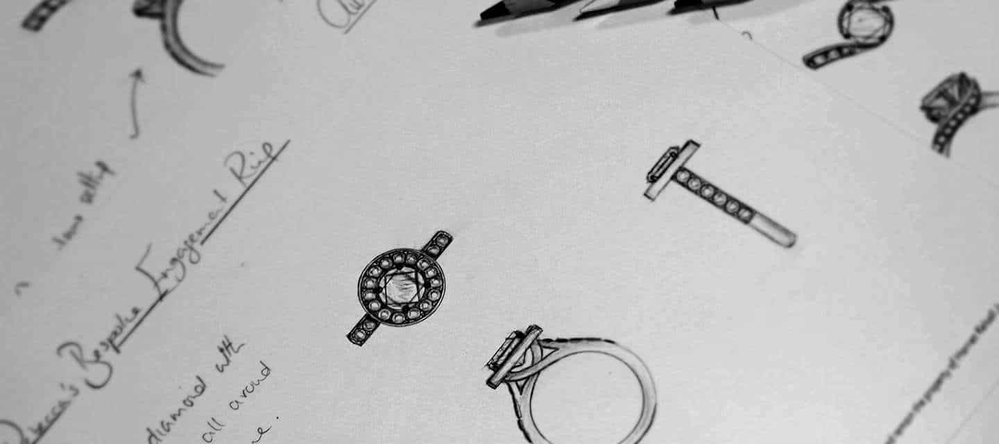 commissioned ring sketches in a notebook