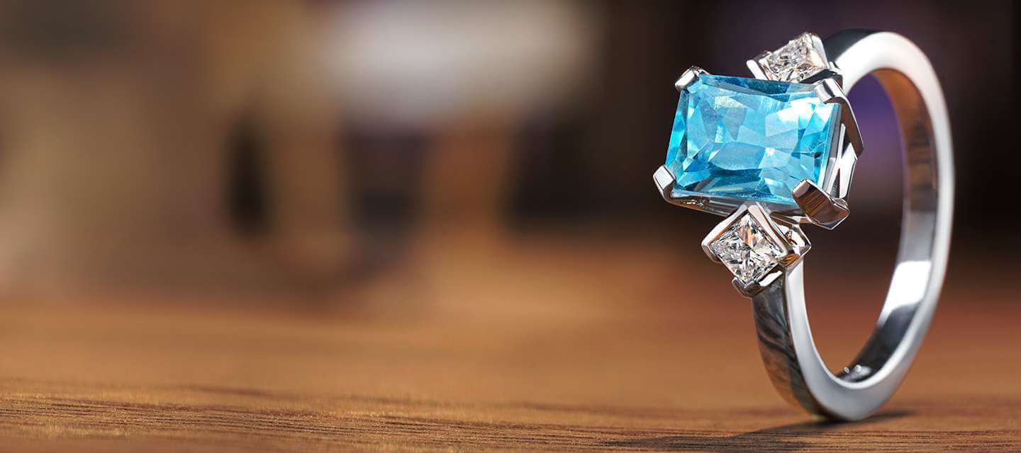 aquamarine ring on wooden table