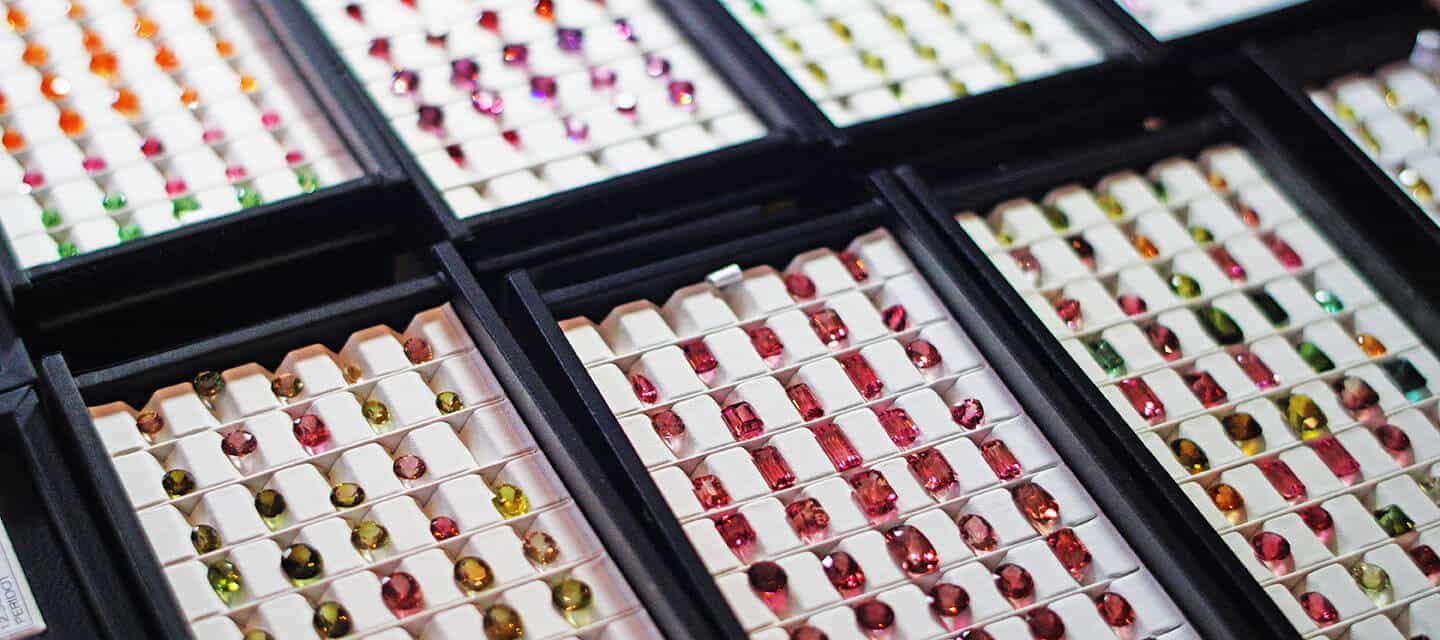 Multicoloured gemstones in display cases