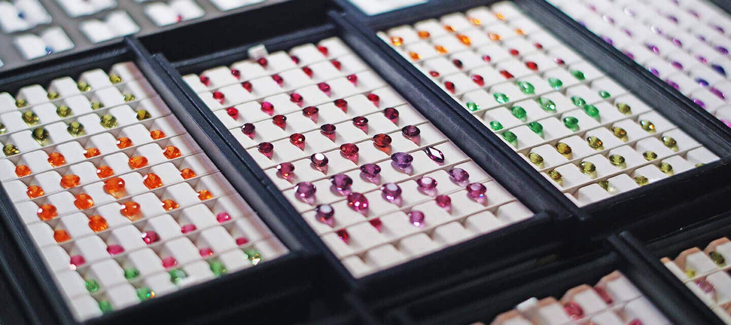 multicoloured gemstones in display cases