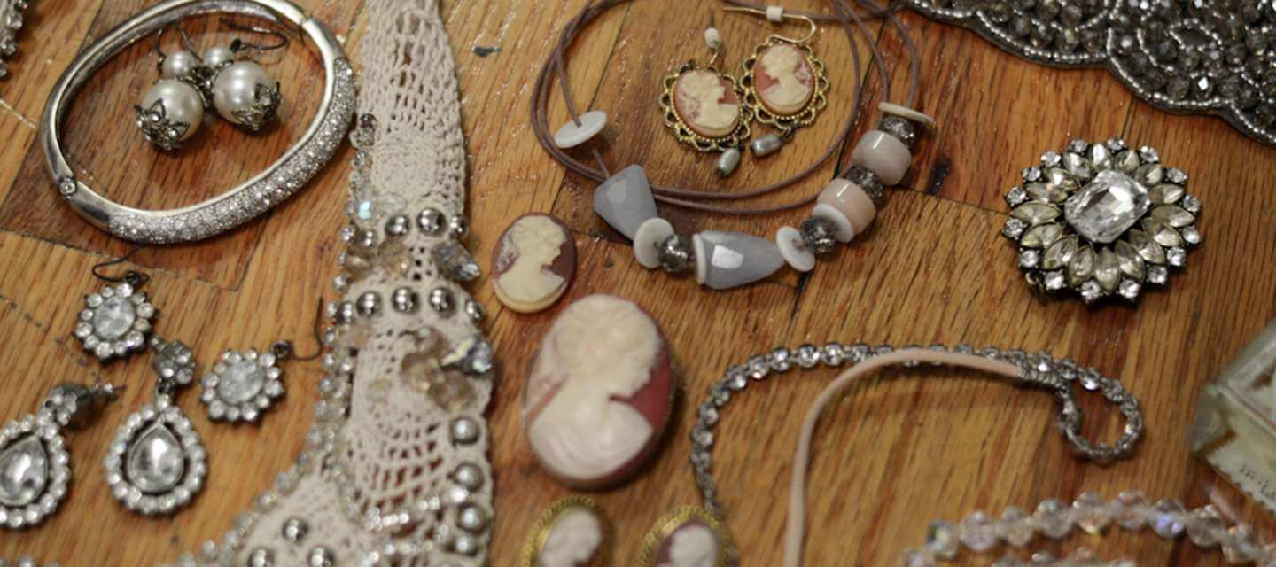 Lots of vintage jewellery on a table