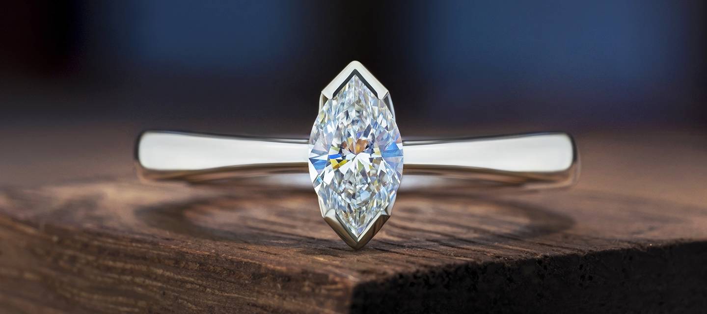 Closeup marquise cut diamond ring on table