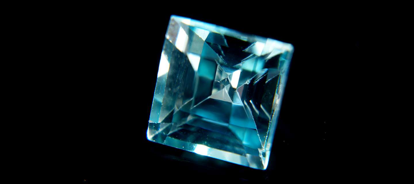 Close up image of a princess cut aquamarine