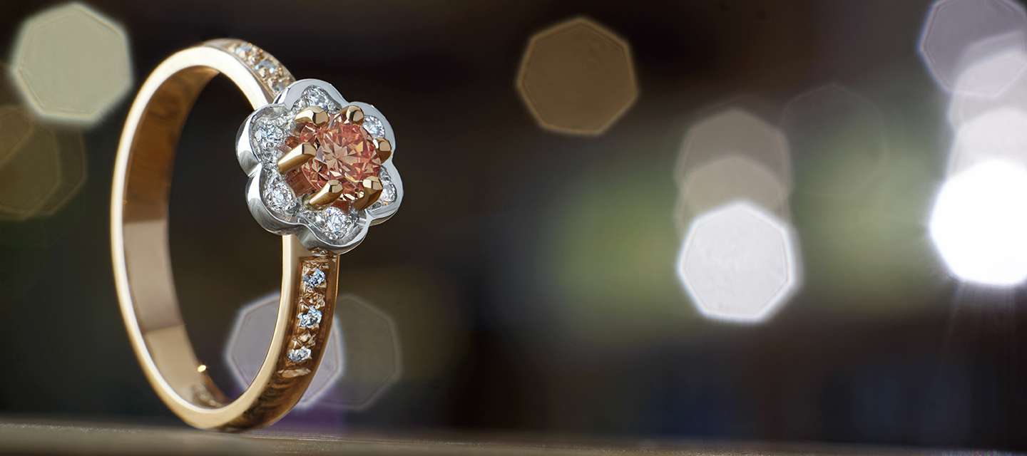 Flower inspired engagement ring with peach diamond