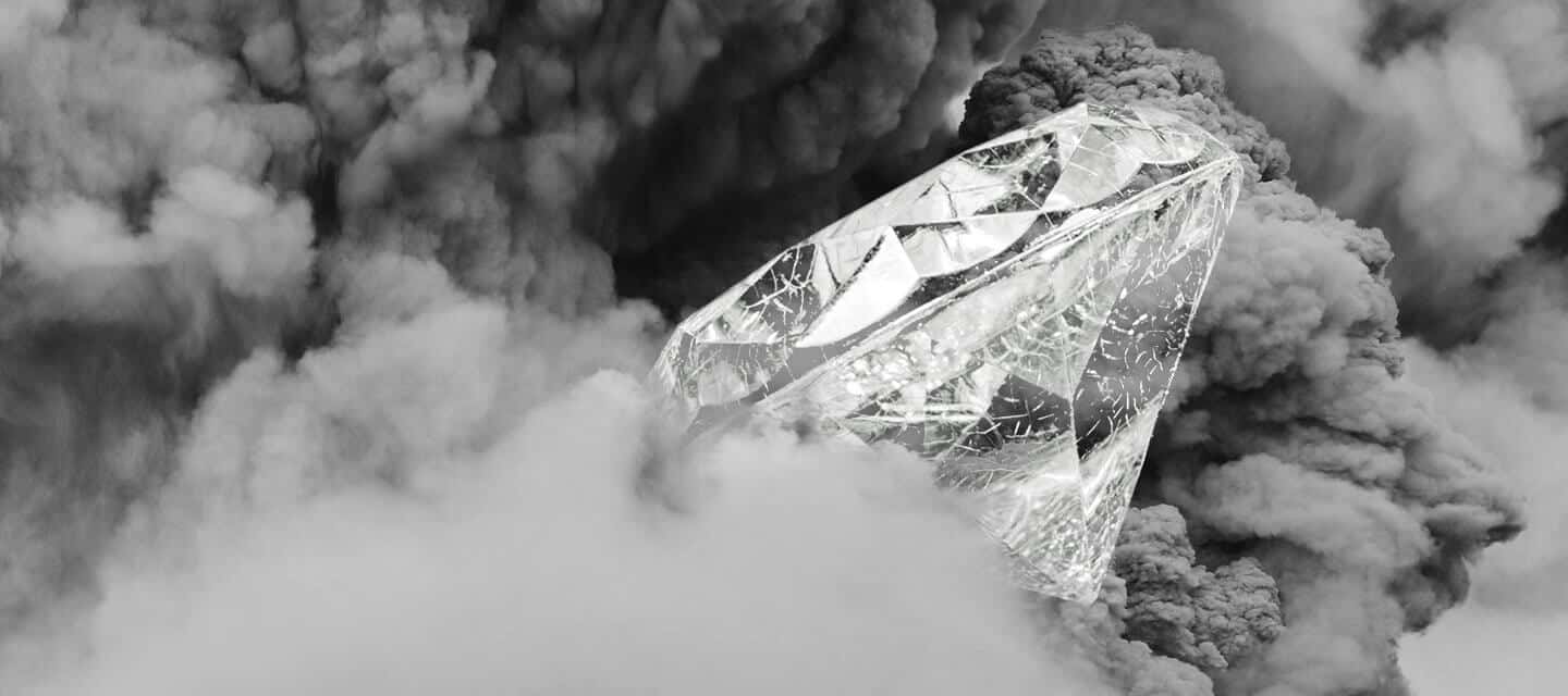 A large diamond surrounded by smoke