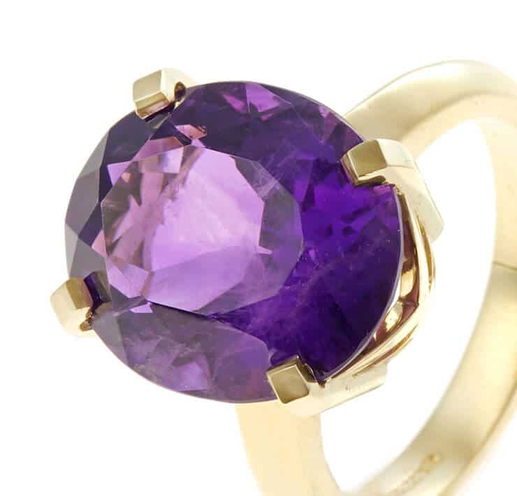 dramatic purple amethyst and gold ring close up