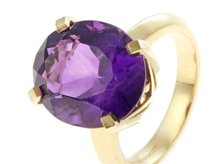 Large single amethyst and gold ring