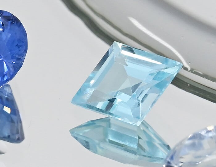 Square cut aquamarine with blue stones