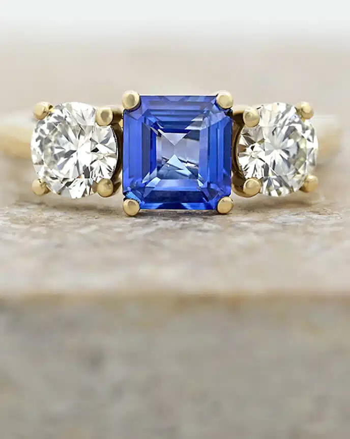 Asscher cut blue sapphire and diamond trilogy