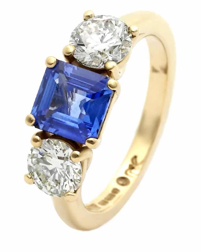 blue central sapphire and diamond gold trilogy