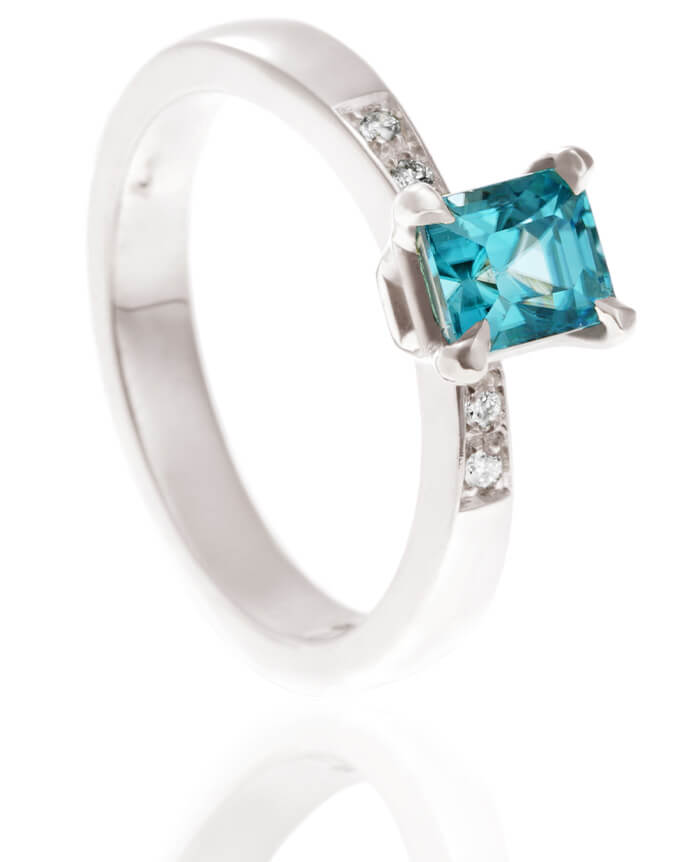 Blue zircon ring with shoulder diamonds