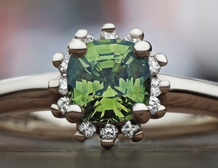 Claw set cushion cut green tsavorite ring