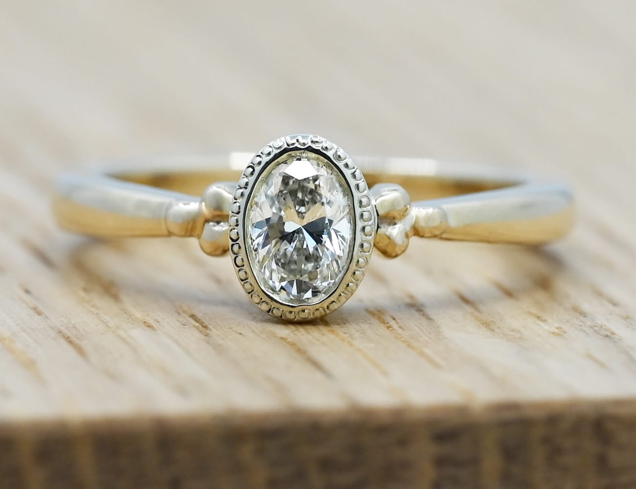 diamond gold solitaire with leaf detail