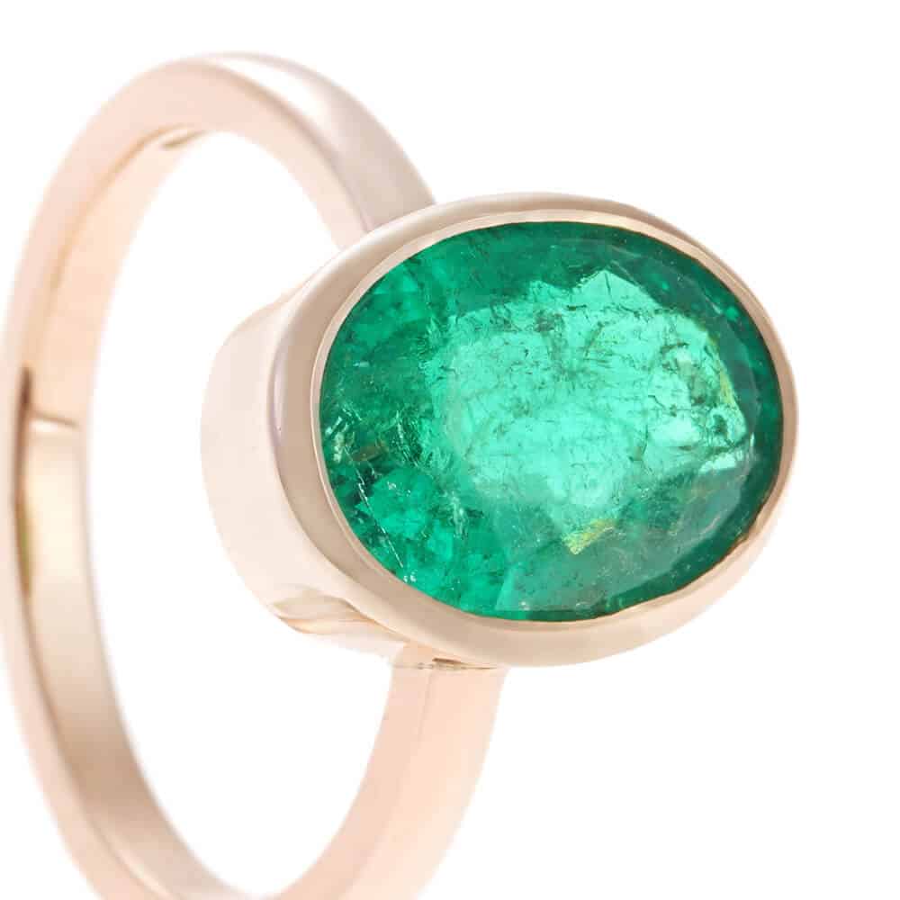 all around set emerald in gold ring