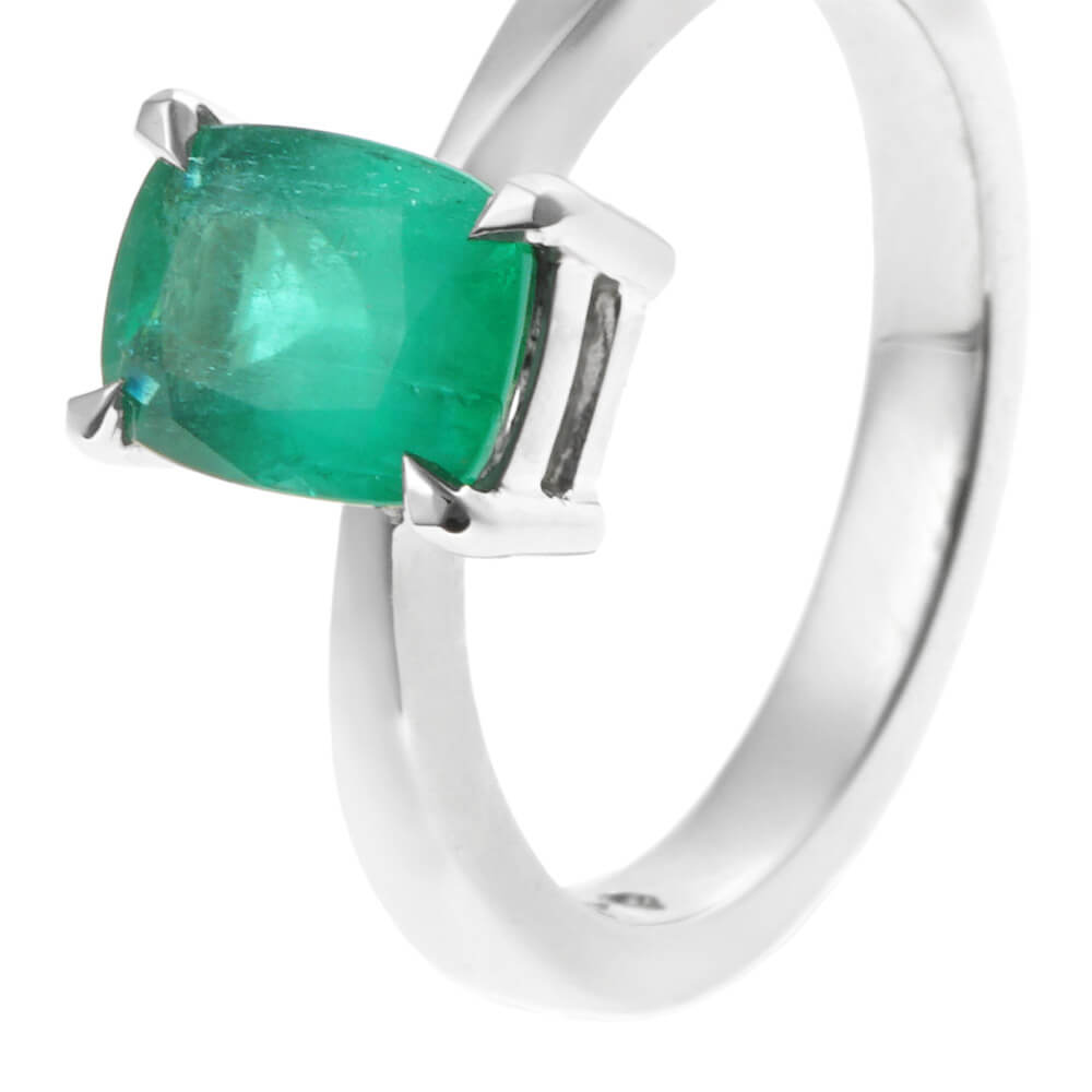 simple white gold ring with cushion cut emerald