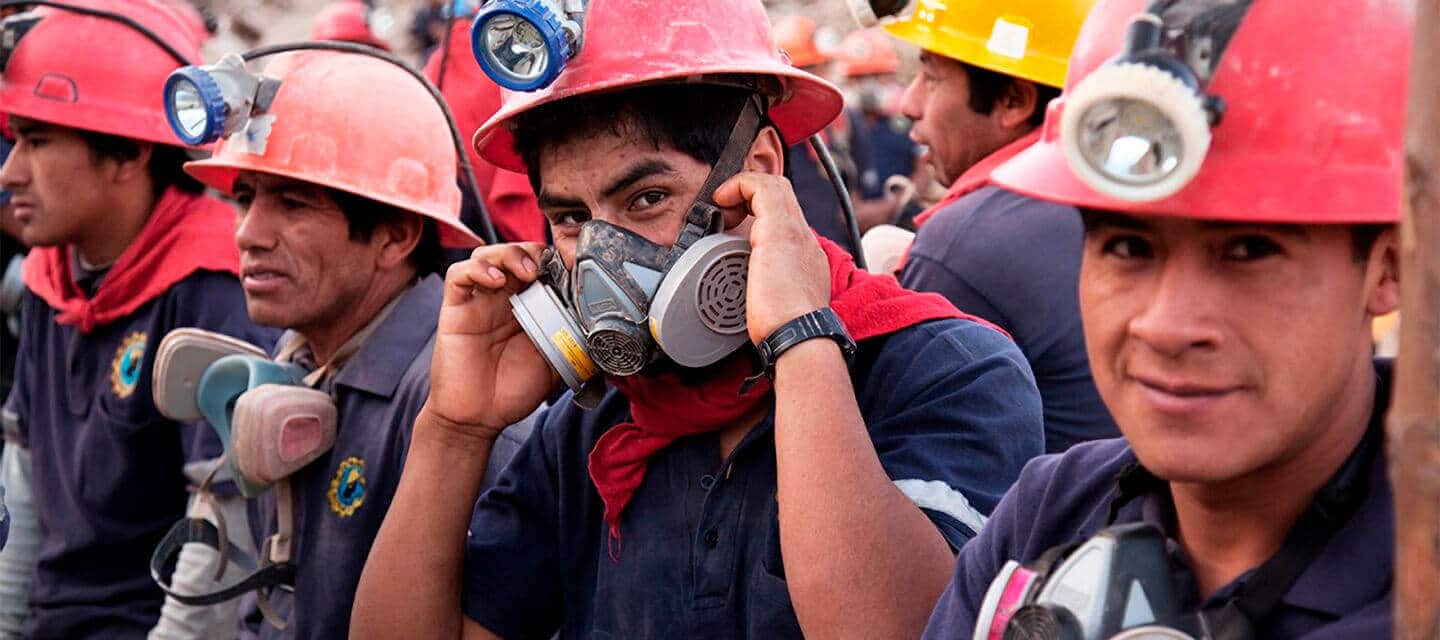 Ethical Fairtrade miners wearing protective clothing