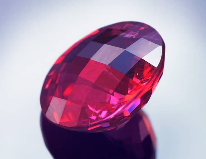 Chequerboard cut bright red spinel