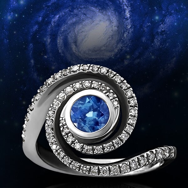 spiral engagement ring with central sapphire and galaxy