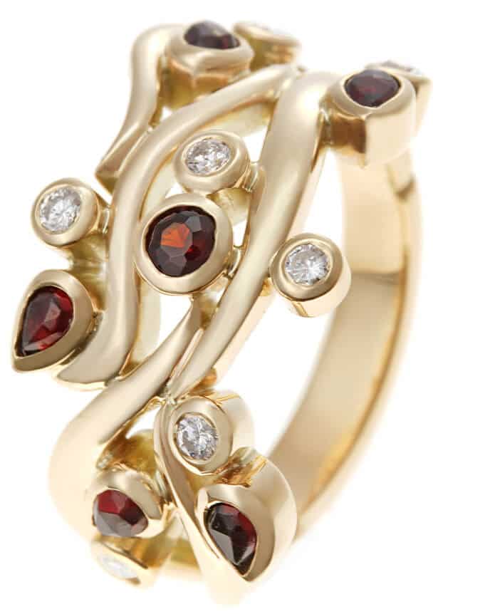 interwoven shaped garnet, gold and diamond ring