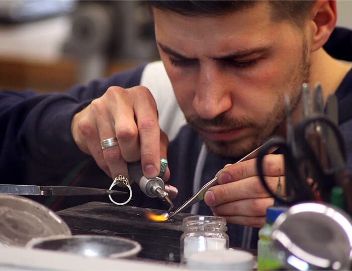 Goldsmith handmaking a ring