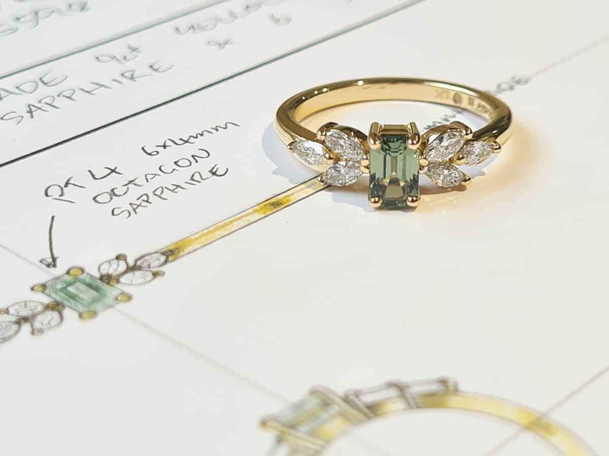 Green sapphire and diamond ring on sketch