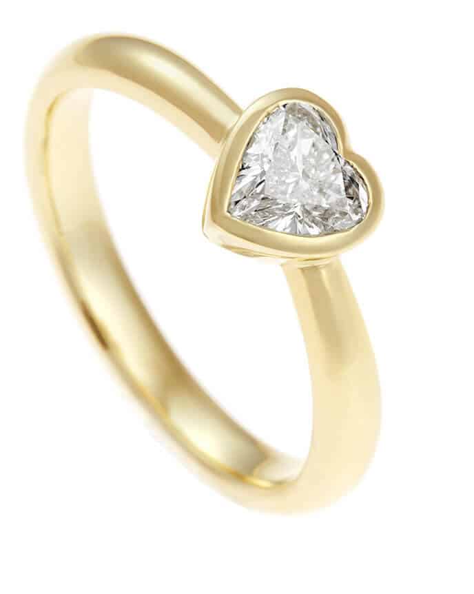 gold engagement ring with heart shaped diamond