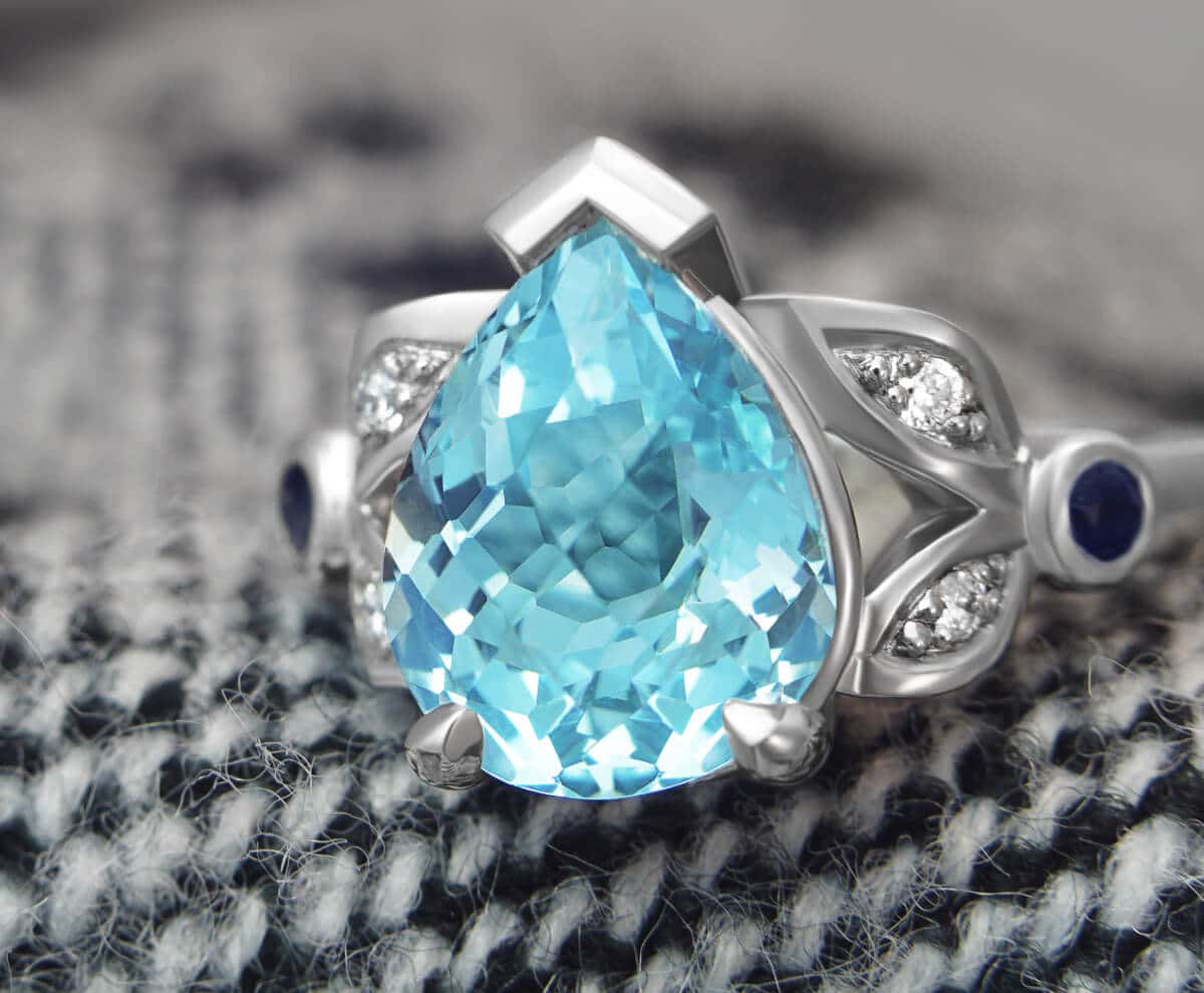 statement aqua topaz ring on rug