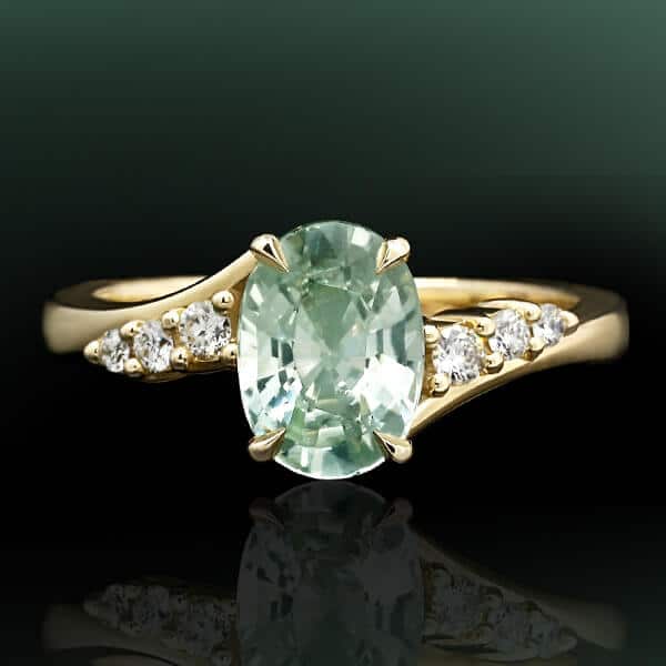 oval mint green sapphire with diamond twist ring design