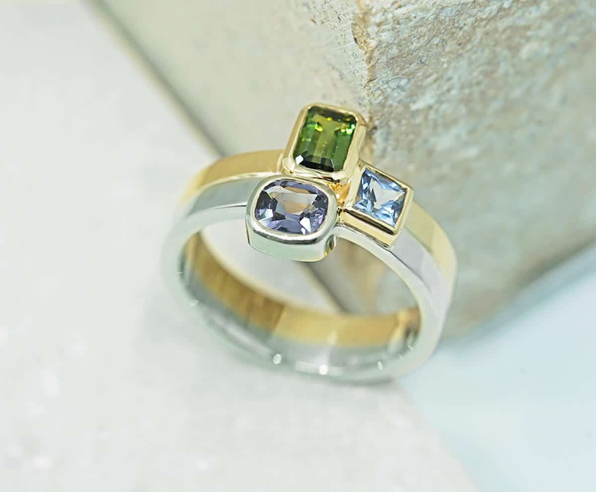 mixed metal and gemstone modern ring