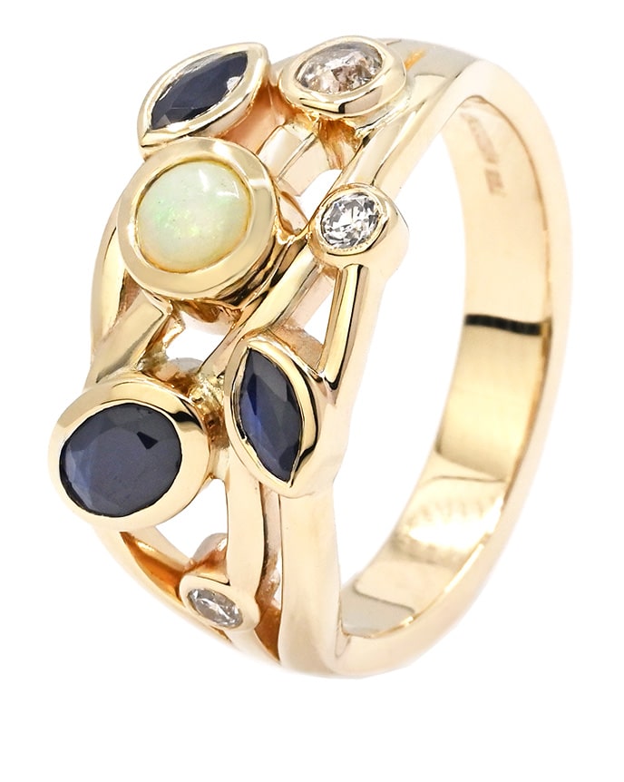 mixed gemstone statement ring in gold