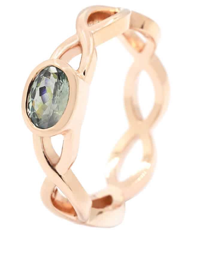 oval green alexandrite and open twist rose gold ring