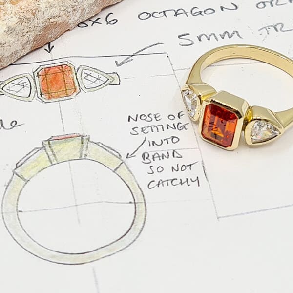 orange cubic zirconia ring on its design sketch