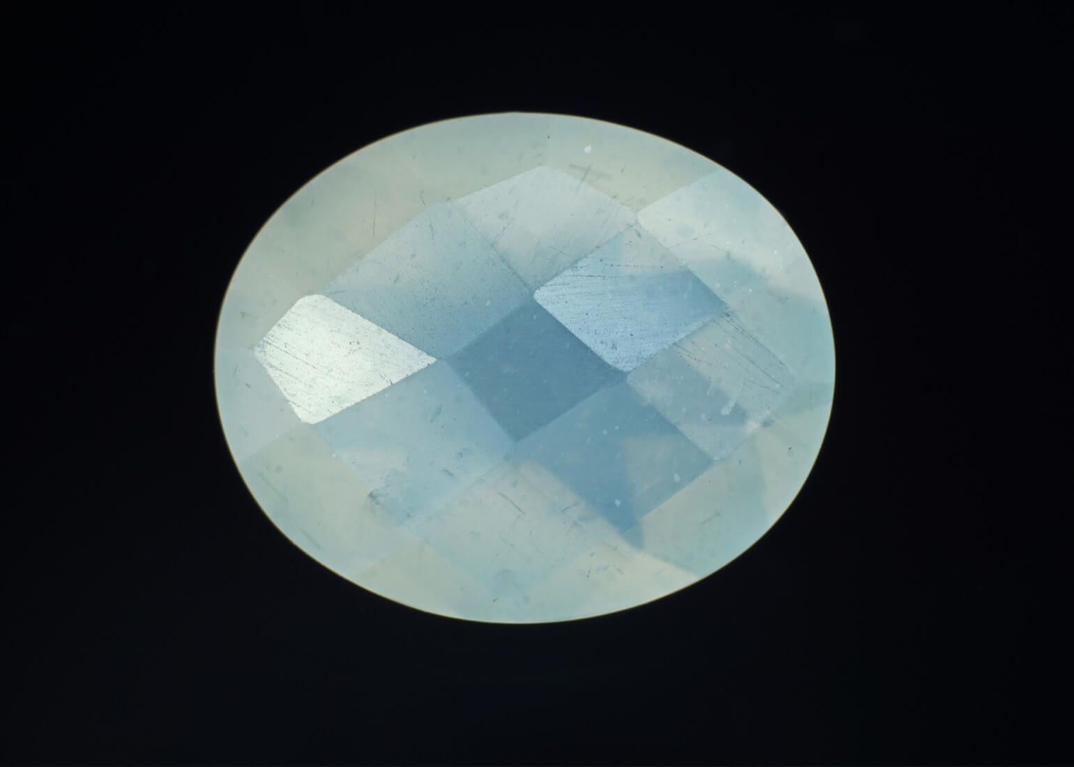 Chequerboard cut blue moonstone on black