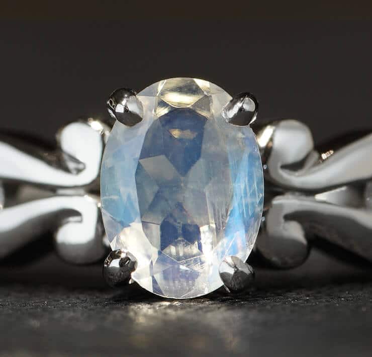 oval facetted blue moonstone ring with detailed setting