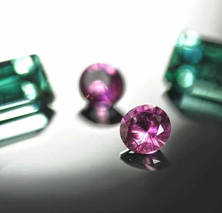 group of tourmalines in pink and green close up