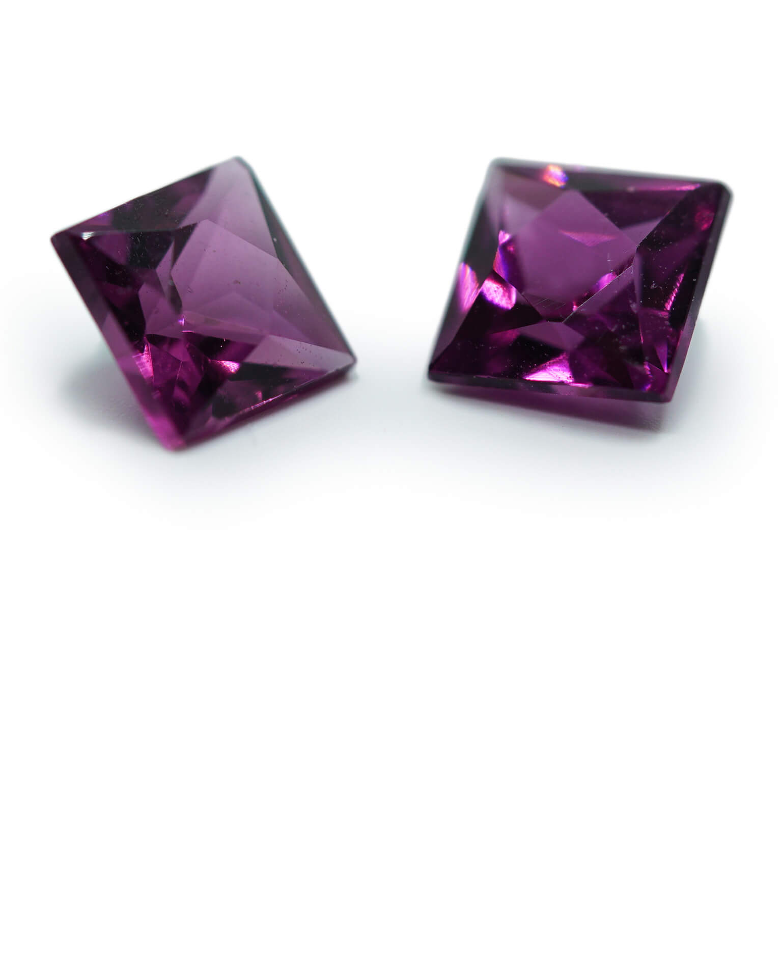 pair of purple rhodalite garnets