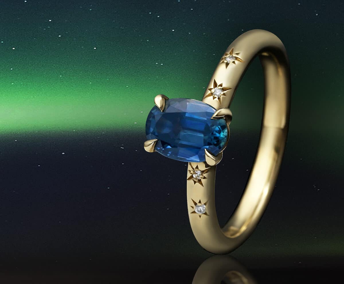 sapphire and star engagement ring with northern lights