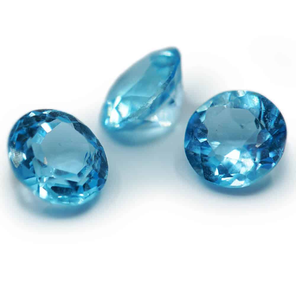 Group of three small round topaz